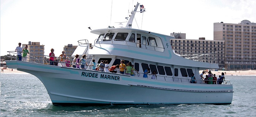 a group of people on a boat in the water